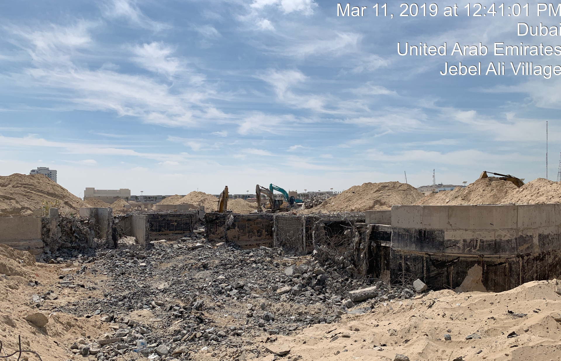 Multiple excavators at Jebel Ali Village foundation demolition