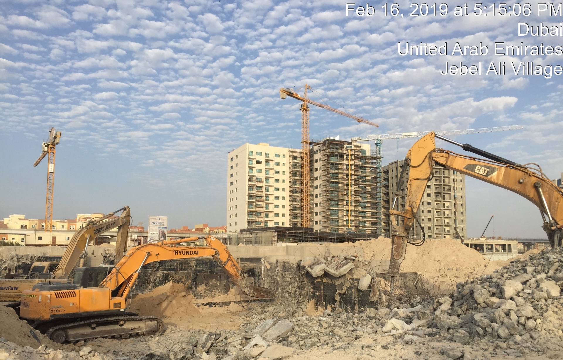 Multiple excavators at large-scale foundation demolition site Dubai
