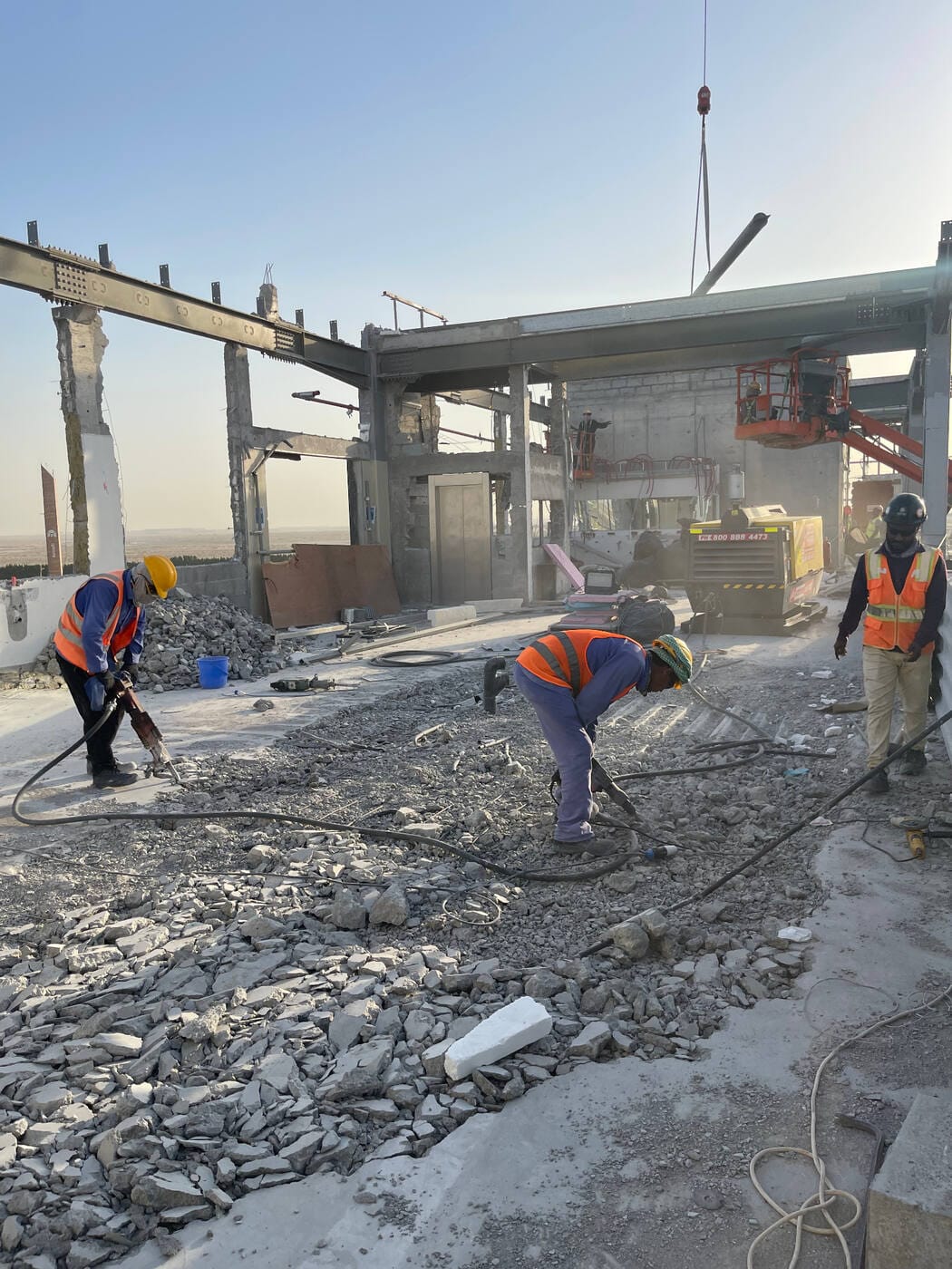 Workers at France Pavilion demolition site