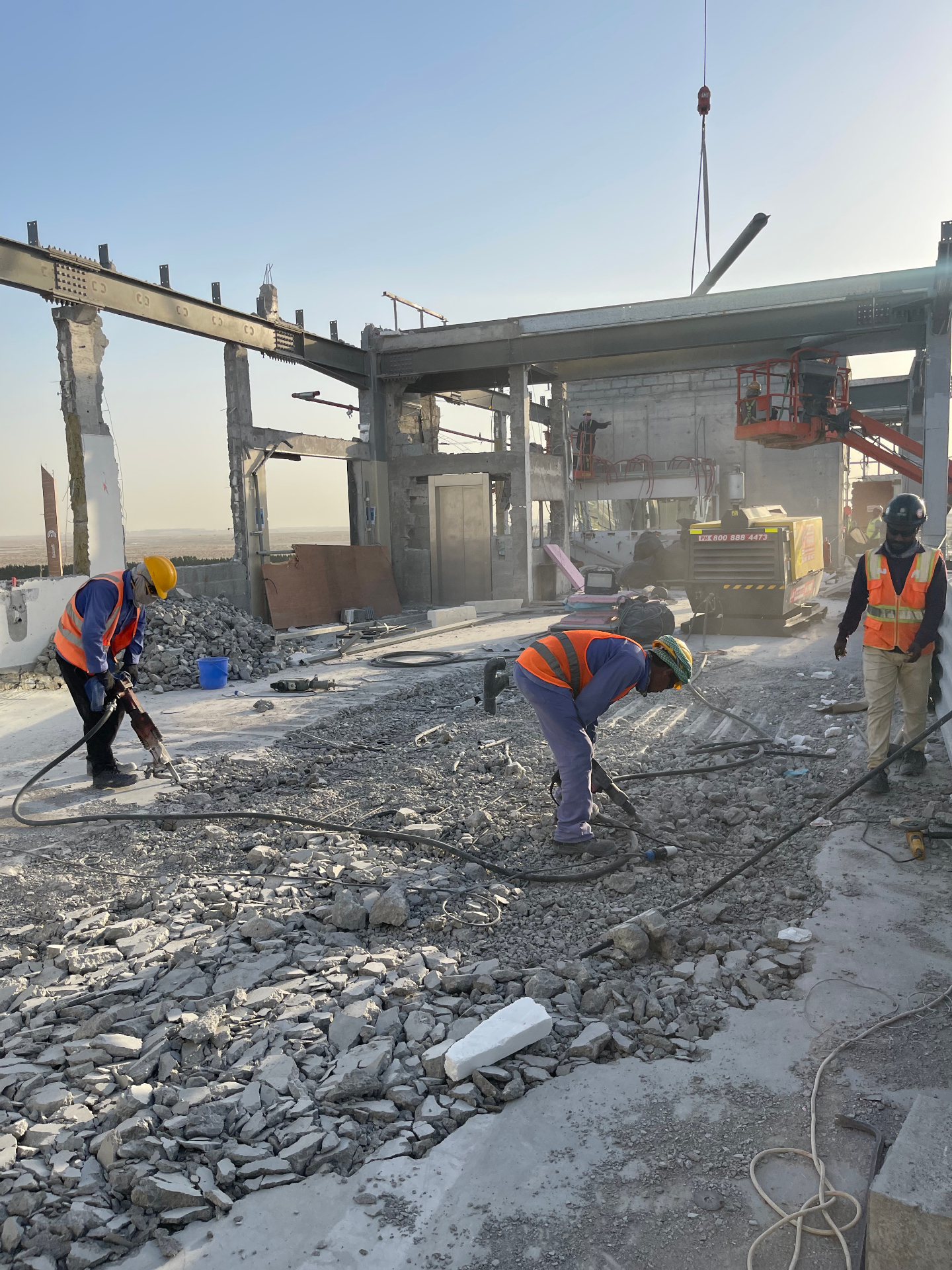 Workers at France Pavilion demolition site