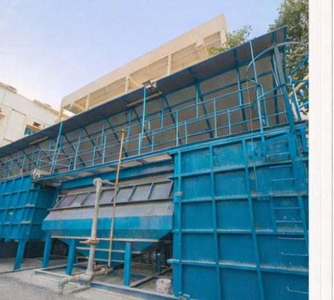 Blue painted steel sewerage treatment equipment and process tanks at G+2 G+3 camp Jebel Ali