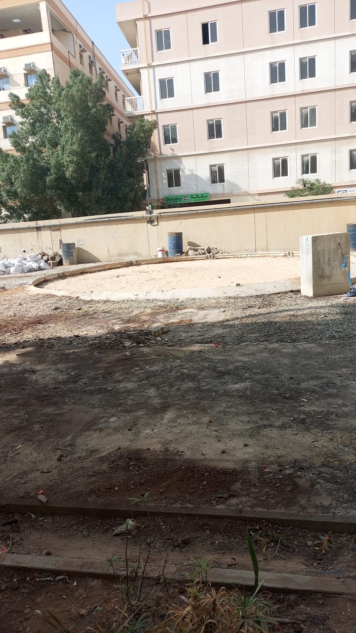 Cleaned and graded ground where sewerage treatment tank once stood at Jebel Ali camp after demolition handover