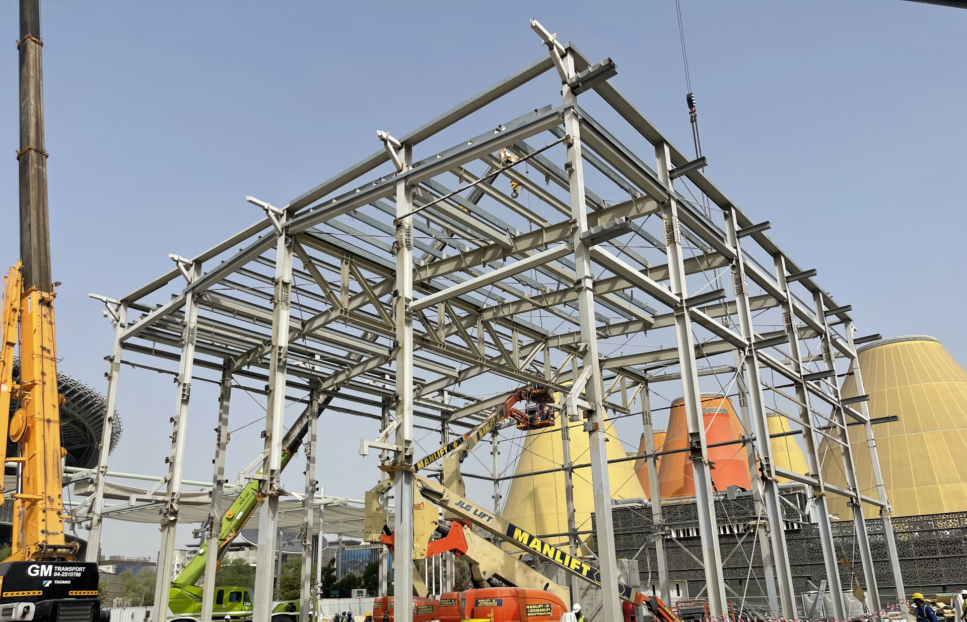 Steel skeleton of New Zealand Pavilion with UAE Pavilion in background