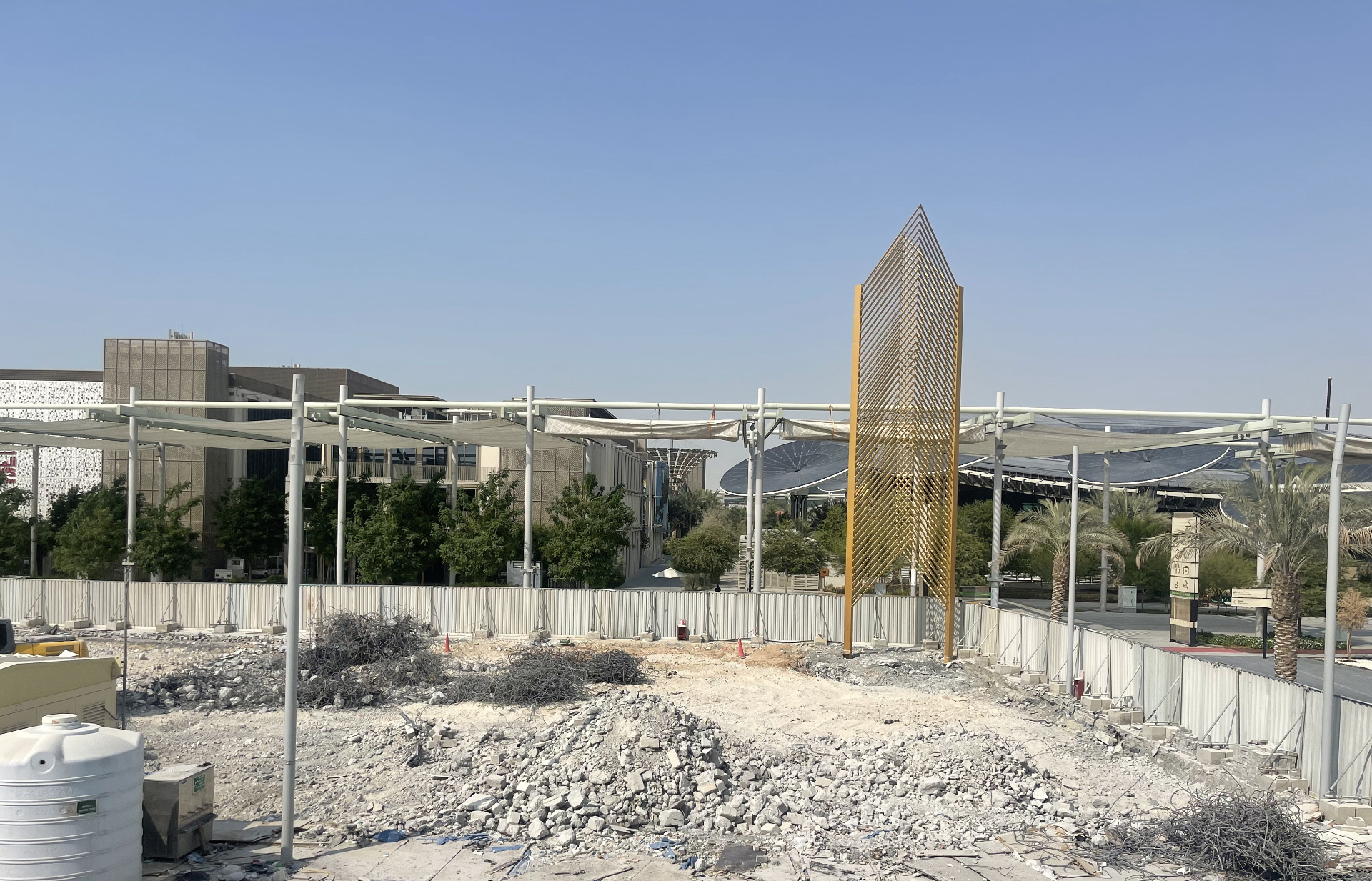 Cleared Qatar Pavilion site with only decorative tower remaining