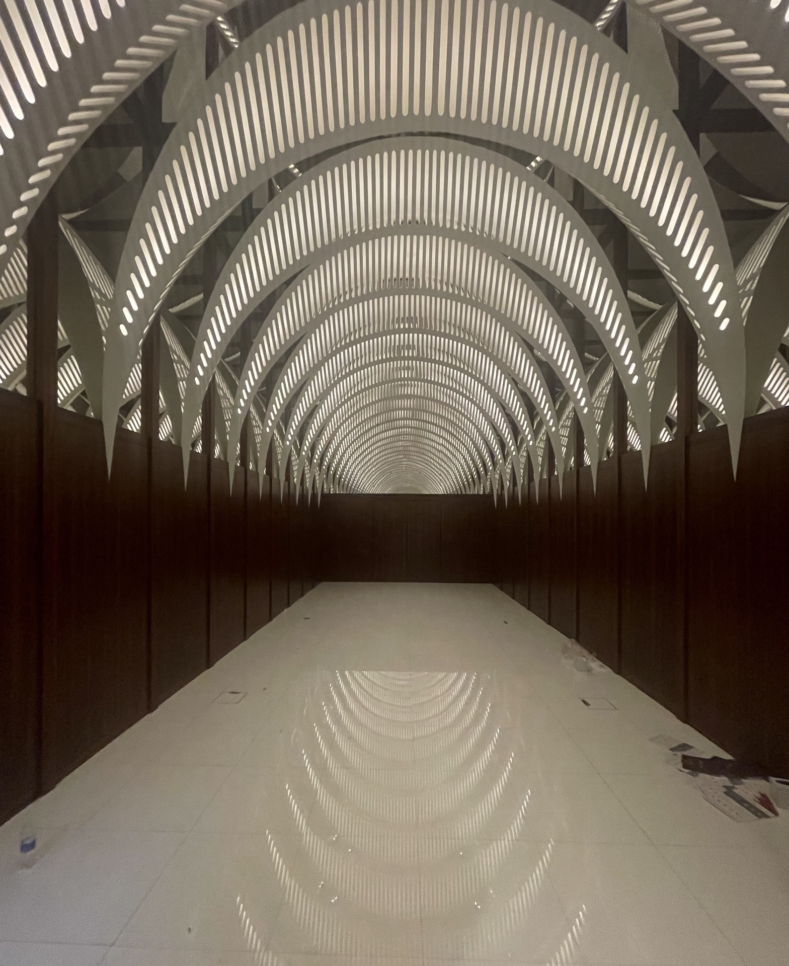Qatar Pavilion arched corridor with dramatic louvered roof structure