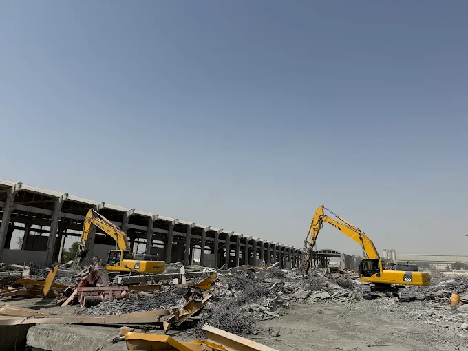 Two USF excavators handling large-scale demolition and scrap segregation on site