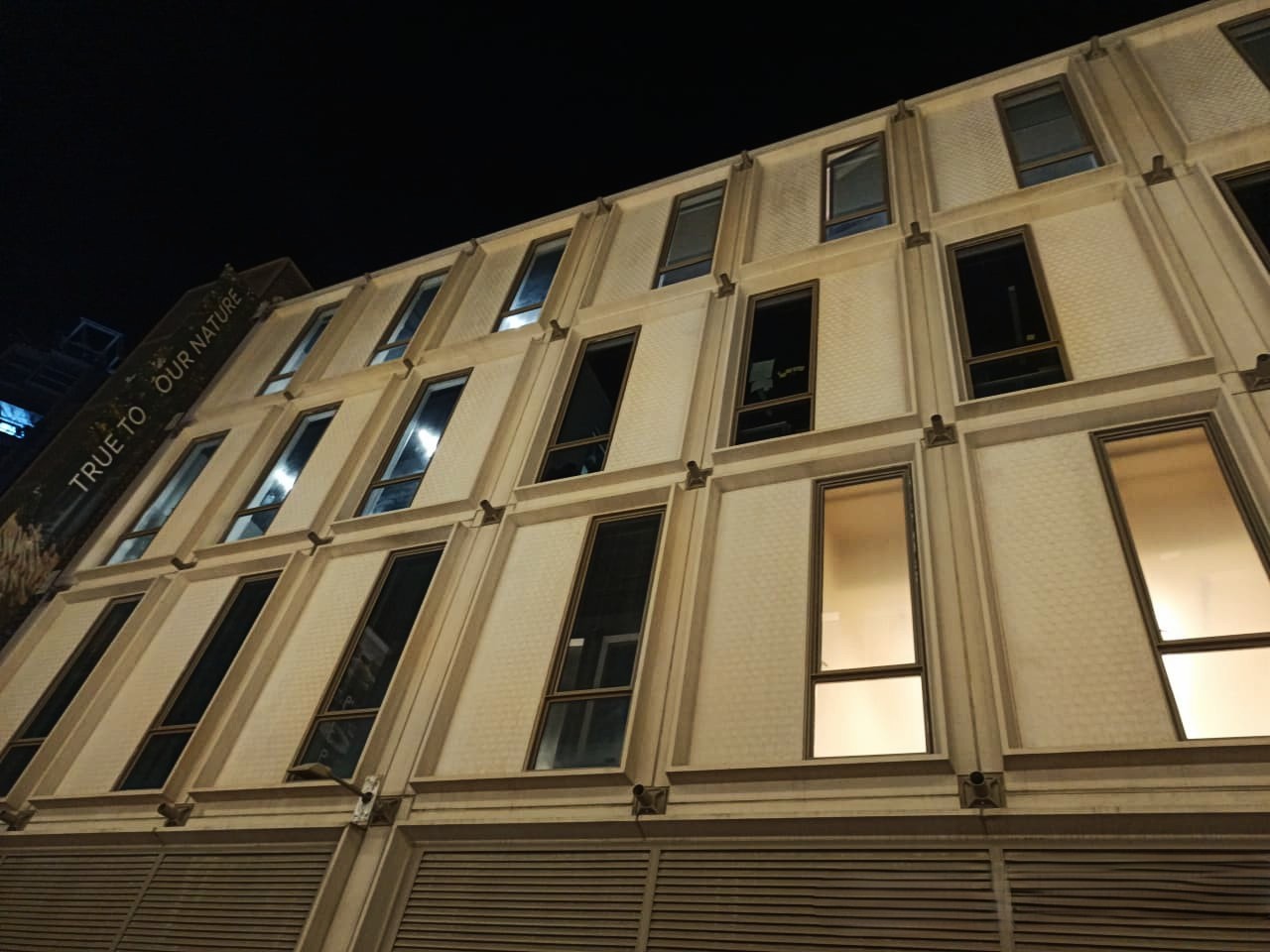 SON building at Expo City Dubai after facade panel removal at night