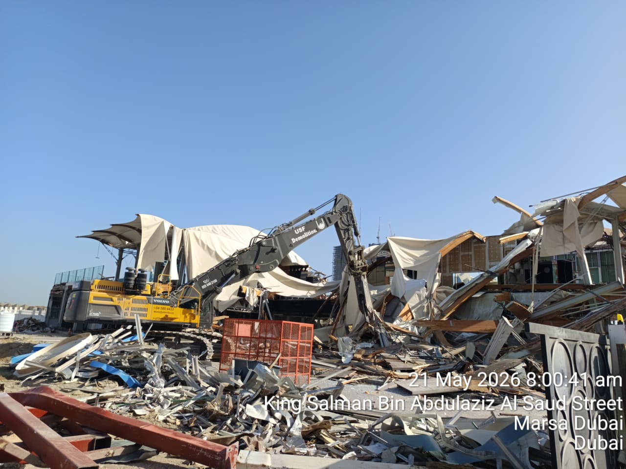 USF Demolition Volvo EC750D excavator dismantling tensile fabric canopies at Zero Gravity Marsa Dubai on King Salman Bin Abdulaziz Al Saud Street