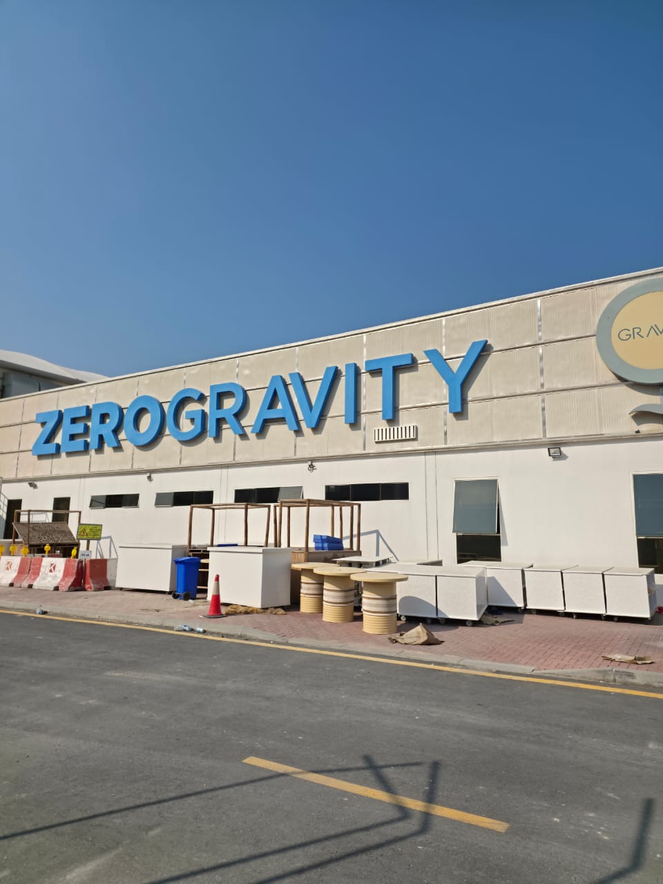 Zero Gravity building exterior with signage during demolition works